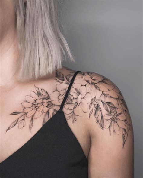 A Woman Amp 39 S Shoulder With Flowers On It