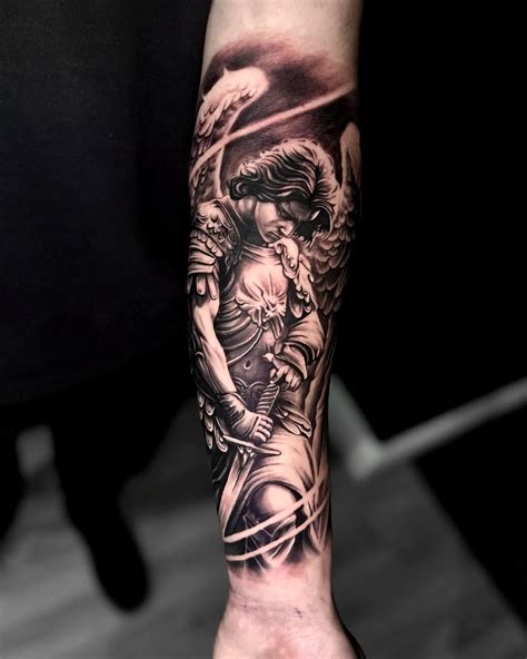 Black And Grey Realism Saint Michael Tattoo On Forearm Archangel Sleeve Idea For Men Black And Grey Realism Saint Michael Tattoo On Forearm Archangel Sleeve Idea For Men