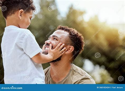 Dad Boy Touch Face In Outdoor Park Or Backyard For Summer Bonding Dad Boy Touch Face In Outdoor Park Or Backyard For Summer Bonding