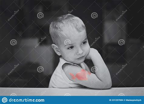 Little Boy With Heart Symbol Tattoo Stock Photo Image Of Confused