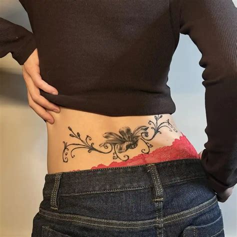 Lower Back Tattoo Designs For Women And Men With Meaning Flowers And