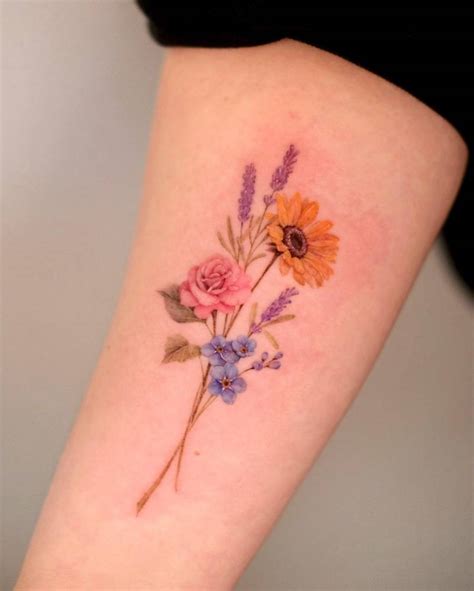 Micro Realistic Flower Bouquet Tattoo Located On The