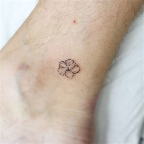 Minimalistic Style Hibiscus Flower Tattoo Located On