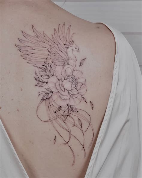 Phoenix And Lion Tattoo Design With Floral Details Phoenix And Lion Tattoo Design With Floral Details